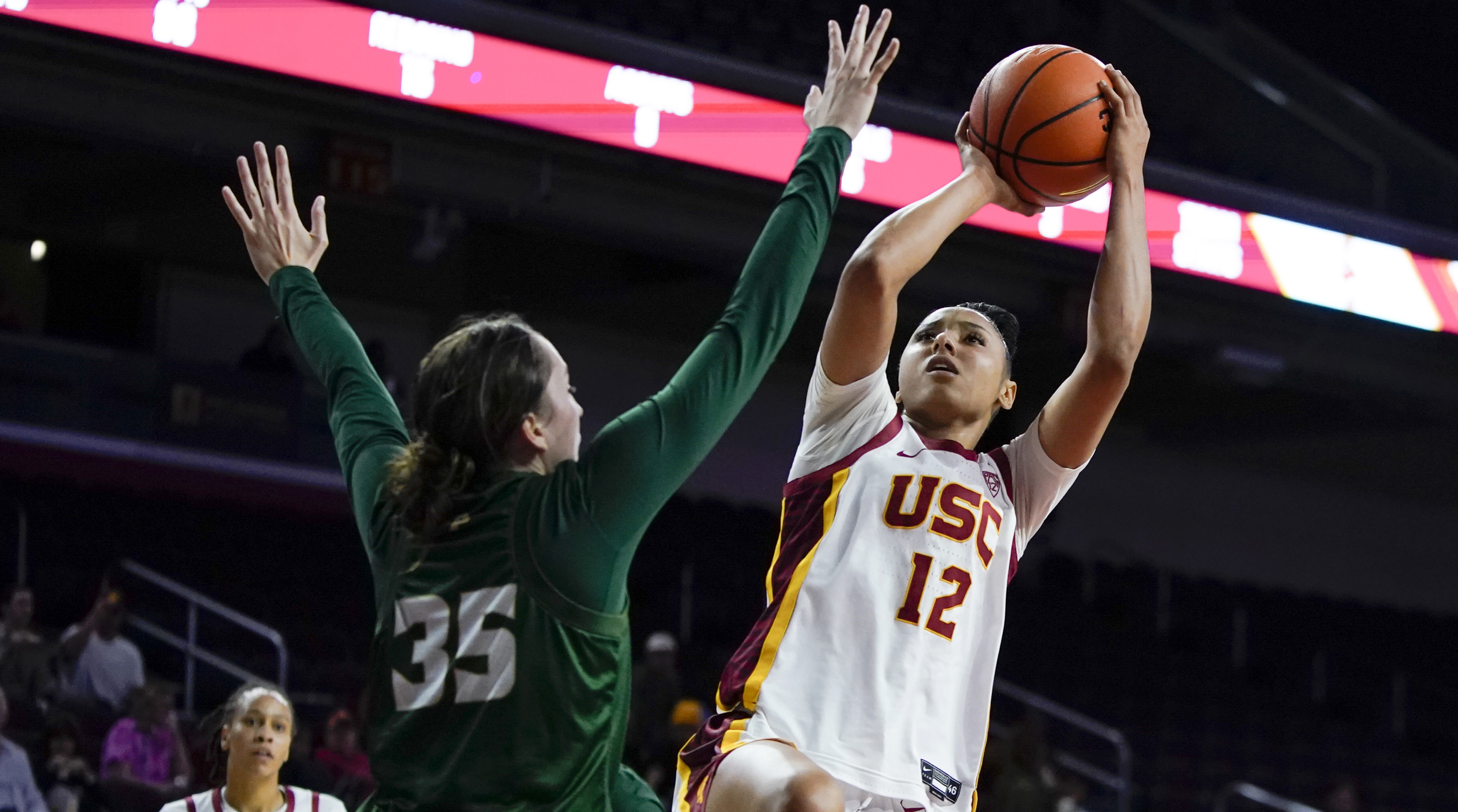 USC guard JuJu Watkins shoots against Cal Poly forward Natalia Ackerman.